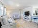 Bright and airy living room with comfortable seating and a modern entertainment center at 16 Hillside Dr, New Smyrna Beach, FL 32169