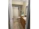 Bathroom featuring a single sink vanity and shower-tub combo at 1629 Travelers Palm Dr, Edgewater, FL 32132