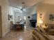 Open-concept dining room featuring tile floors, stylish decor, and access to outdoor living area at 1629 Travelers Palm Dr, Edgewater, FL 32132