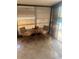 Small tiled patio with table and chairs, providing a sunny place to relax by the pool at 1629 Travelers Palm Dr, Edgewater, FL 32132