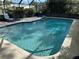 The sparkling in-ground pool is the focal point of outdoor recreation and leisure at 1629 Travelers Palm Dr, Edgewater, FL 32132