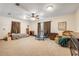 Spacious bonus room featuring neutral carpet, ceiling fan, and abundant natural light at 1663 Hideaway Ln, Edgewater, FL 32132