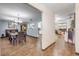 Open-concept dining area with tile floors, a view into the kitchen, and a seamless flow to the living spaces at 1663 Hideaway Ln, Edgewater, FL 32132