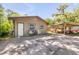 Exterior view of a property featuring a shed, covered parking, and a concrete driveway at 1663 Hideaway Ln, Edgewater, FL 32132