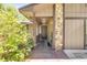 Cozy front porch featuring stone accents, a covered entryway, and well-maintained landscaping at 1663 Hideaway Ln, Edgewater, FL 32132