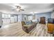 Spacious living room with hardwood floors, ceiling fans, and a comfortable seating area at 1663 Hideaway Ln, Edgewater, FL 32132