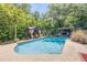 Backyard view of the swimming pool, gazebo, and grill at 1663 Hideaway Ln, Edgewater, FL 32132