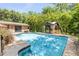 Backyard shot of a swimming pool with gazebo and small sitting area at 1663 Hideaway Ln, Edgewater, FL 32132