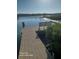 Community dock with bench for residents to enjoy the lake at 168 N Cory Dr, Edgewater, FL 32141