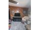Comfortable living room with wood paneling, modern furnishings, and ample natural light at 168 N Cory Dr, Edgewater, FL 32141