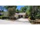 Inviting single-story home with a well-maintained lawn and mature trees, presenting an appealing curb appeal at 171 Fox Glen Ct, Ormond Beach, FL 32174