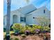 Charming single-Gathering home boasts a well-manicured lawn and covered entryway, offering classic curb appeal at 181 Caryota Ct, New Smyrna Beach, FL 32168