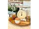 Rustic kitchen decor featuring vintage scale, wooden tray, and charming decorative items at 181 Caryota Ct, New Smyrna Beach, FL 32168