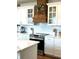 Modern kitchen with white cabinetry, subway tile backsplash, and stainless steel appliances at 181 Caryota Ct, New Smyrna Beach, FL 32168