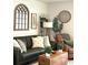 Stylish living room featuring a comfortable sofa, accent chairs, and decorative elements at 181 Caryota Ct, New Smyrna Beach, FL 32168
