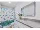 Bathroom featuring a granite countertop, modern fixtures, and a shower at 1855 Pine Tree Dr, Edgewater, FL 32141