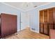 Bedroom featuring wood-look floors, a ceiling fan and blue walls at 1855 Pine Tree Dr, Edgewater, FL 32141