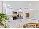Bright kitchen with granite countertops, stainless steel appliances, and ample storage space at 1855 Pine Tree Dr, Edgewater, FL 32141
