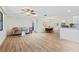 Bright and spacious living room with wood floors, neutral walls, and modern furniture at 1855 Pine Tree Dr, Edgewater, FL 32141
