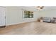 Inviting living area with wood floors, natural light, and a cozy seating arrangement at 1855 Pine Tree Dr, Edgewater, FL 32141