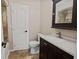 Bathroom featuring a granite countertop vanity and tile flooring at 1868 Pine Tree Dr, Edgewater, FL 32141