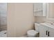 Bright bathroom featuring a vanity with white cabinets and a tiled shower at 1868 Pine Tree Dr, Edgewater, FL 32141