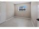 Cozy bedroom showcasing tile floors, window, and a closet at 1868 Pine Tree Dr, Edgewater, FL 32141