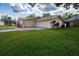 Charming single-story home featuring a two-car garage at 1868 Pine Tree Dr, Edgewater, FL 32141