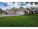 Charming single-story home featuring a two-car garage at 1868 Pine Tree Dr, Edgewater, FL 32141