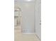 Entryway showing neutral walls, tile flooring, and nearby laundry area at 1868 Pine Tree Dr, Edgewater, FL 32141