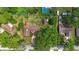 Expansive property featuring a private pool, mature trees, and a well-manicured lawn at 1905 Pine Tree Dr, Edgewater, FL 32141
