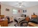 Simple bedroom featuring neutral paint, single bed, and lots of wood furniture and storage at 1905 Pine Tree Dr, Edgewater, FL 32141