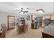 Eat-in kitchen featuring tile floors, appliances, and a dining table with chairs at 1905 Pine Tree Dr, Edgewater, FL 32141