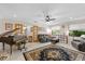 Inviting living room featuring hardwood floors, a grand piano, and comfortable seating at 1905 Pine Tree Dr, Edgewater, FL 32141