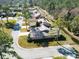 An aerial view of single Gathering homes nestled in lush landscaping on a quiet street with cul-de-sac at 1918 Whisperwood Way # 10, Port Orange, FL 32128