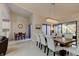 Elegant dining room with chandelier and view to the outdoor area at 1918 Whisperwood Way # 10, Port Orange, FL 32128