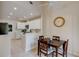Cozy eat-in kitchen features stainless appliances, white cabinetry and dining table at 1918 Whisperwood Way # 10, Port Orange, FL 32128
