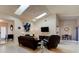Bright living room featuring skylights, comfortable seating, and neutral tones at 1918 Whisperwood Way # 10, Port Orange, FL 32128