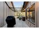 Covered patio with outdoor seating and grill at 1918 Whisperwood Way # 10, Port Orange, FL 32128