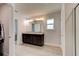 Bathroom featuring double sinks, a large mirror, and a walk-in shower at 208 Lagoon Mist Ct, Oak Hill, FL 32759