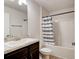 Bathroom featuring a vanity with a sink and a shower-tub combo at 208 Lagoon Mist Ct, Oak Hill, FL 32759