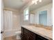 Bathroom featuring a shower-tub combination and modern vanity with granite countertop at 208 Lagoon Mist Ct, Oak Hill, FL 32759