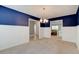 Bright dining room with chandelier that connects to the living room at 208 Lagoon Mist Ct, Oak Hill, FL 32759