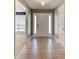 Inviting entryway with tiled floor and white front door with sidelights at 208 Lagoon Mist Ct, Oak Hill, FL 32759