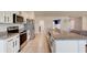 Bright kitchen with stainless steel appliances, granite countertops, and a large island at 208 Lagoon Mist Ct, Oak Hill, FL 32759