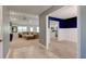 Spacious living room flows into the kitchen with stainless steel appliances at 208 Lagoon Mist Ct, Oak Hill, FL 32759