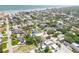 Aerial view of a coastal community with houses, trees, and the ocean in the background at 212 Due East St, New Smyrna Beach, FL 32169