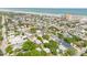 Expansive aerial view showcasing a vibrant coastal neighborhood near the beach and ocean at 212 Due East St, New Smyrna Beach, FL 32169