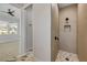 Walk-in shower featuring decorative tile and niche, offers a luxurious showering experience at 212 Due East St, New Smyrna Beach, FL 32169