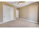 Cozy bedroom with plush carpet, featuring a closet and an open doorway, bathed in natural light at 212 Due East St, New Smyrna Beach, FL 32169